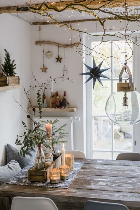 A cozy dining area decorated with candles, greenery, and twinkling lights. A cozy dining area decorated with candles, greenery, and twinkling lights.